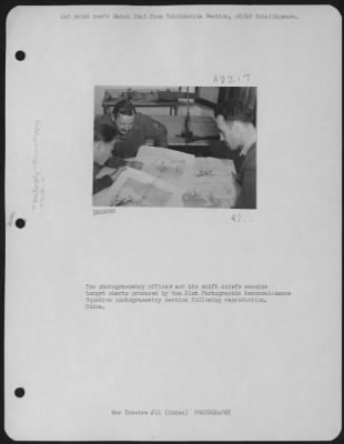 Thumbnail for Operations & Mapping > The Photogrammetry Officer And His Shift Chiefs Examine Target Charts Produced By The 21St Photographic Reconnaissance Squadron Photogrammetry Section Following Reproduction.  China.