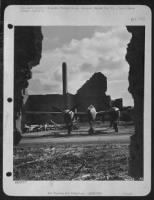 A 9th Air force Lockheed P-38 Lightning fighter-bomber, framed by wreckage wrought on this ofrmer Luftwaffe base by Allied air power. Parked on a hardstand in Belgium. Operating from bases close to the fighting fronts, Lightnings, Thunderbolts - Page 1
