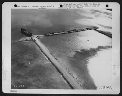 Thumbnail for General > Constructed By Ncb'S, To Facilitate Unloading Of Lsts And Lsms, Coral Built Road Jetties Were Built Into The Water To Enable Trucks To Move Up To The Ships For Unloading Of Their Cargo.  30 June 1945, Okinawa.