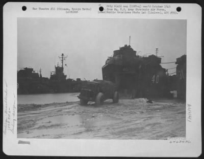 Thumbnail for General > Heavy Equipment Rolls Off One Of The Lst (Landing Ship Tanks) During Landing Operations F The 1878Th Engineer Aviation Battalion At Okinawa, Ryukyu Retto On The Night Of 3 May 1945.