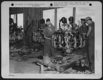 Thumbnail for Engines > In The Engine 'Build-Up' Shop On Yontan Airstrip, Mechanics Of The 13Th Air Service Group Rebuild A Pratt & Whitney Engine.  This Type Of Engine Was Used In Consolidated B-24 'Liberators'.  Okinawa, Ryukyu Retto, 9 August 1945.