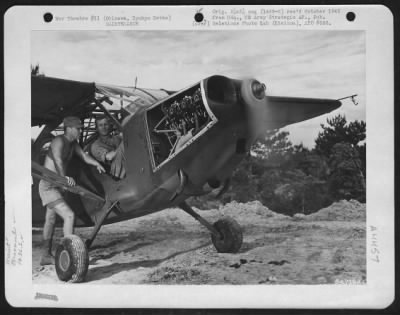 Thumbnail for General > M/Sgt. Harold W. Andresen Tunes Up Engine Of A Vultee L-5 Of The 163Rd Liaison Squadron, Attached To The 10Th Army; Lt. William E. Bergelin Listens To The Steady Hum Of The Engine.  Okinawa, Ryukyu Retto.  1945.