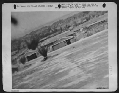 General > Low Level View Of Japan -- This Gun Camera Photograph Of The First Strafing Mission On A Jap Mainland Target By P-51 Mustangs Of The U.S. Army 7Th Fighter Command Shows 50-Cal. Ammunition Pouring Into The Hangars And Shop Buildings Of The Kanoya East Airf