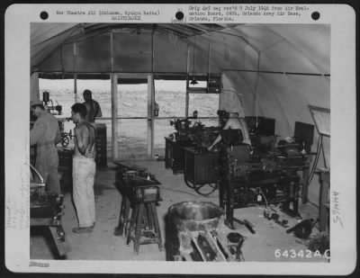 Thumbnail for Miscellaneous > This Machine Shop Of The 613Th Air Engineer Squadron Was Set Up In 'Quonset Huts' On Yontan Airstrip To Do Work For The 7Th Air Force.  At The Right (Foreground) Is A Lathe Of Japanese Make; The Other Two In Background Are Of American Manufacture.  9 Augu