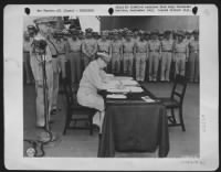 General Of The Army Douglas Macarthur Signs As The Supreme Allied Commander During Formal Surrender Ceremonies On The U.S.S. Missouri In Tokyo Bay, August 31, 1945.  Behind Gen. Macarthur Are Lt. Gen. Jonathan Wainwright (Left) Who Surrendered To The Japa - Page 1
