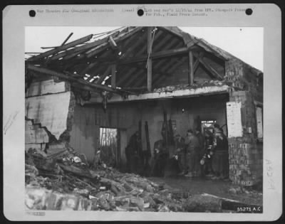 Thumbnail for General > 9th Air force ground crew members going through a "chow" line in their mess building, once part of a Luftwaffe installation, at a base in Belgium. Since they serviced their first plane on a Normandy airstrip, the men shown in the photograph have had