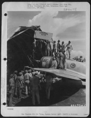 Thumbnail for General > Pilots And Ground Crewmen Of The 19Th Fighter Squadron, 318Th Fighter Group, Clamber Over Republic P-47 Thunderbolt 'Little Rock Ette' To Hand Scoreboard Showing Number Of Japanese Airplanes Downed.  On Roof Is M/Sgt. Sam T. Speranza.  On Frame Above Nose