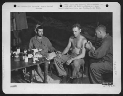 Thumbnail for Clinicaltreatment > Squadron Medic Treating Two Men Who Were Shot By The Guard They Were To Relieve.  Okinawa, Ryukyu Retto.