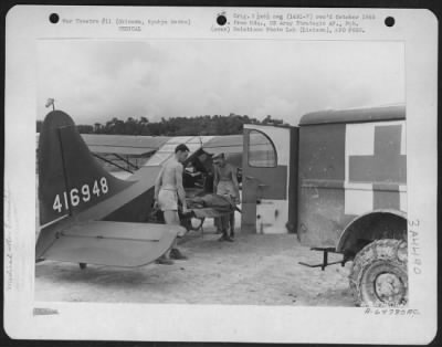 Thumbnail for Evacuation > Medics Transferring Litter Patient From Vultee L-5 'Sentinel' To Awaiting Ambulance.  Evacuation Cases Were Flown To Field No 10, Okinawa, Ryukyu Retto.