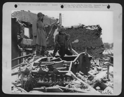 General > This Tiger Tank parked between two houses in a Belgium village held up 4th Armored Division tanks until it was battereed by two 500 pound bombs dropped by a Republic P-47 Thunderbolt. The three P-47 pilots who strafed and bombed in the immediate