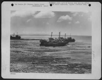 Thumbnail for General > Okinawan Water Transportation -- High And Dry - A Low Tide Left These Okinawan Boats Aground In Naha Harbor.  This Type Of Boat Is Being Used For Inter-Island Transportaton In The Ryukyus As The Natives Attempt To Get Back On Their Feet From The Results O