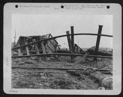 Thumbnail for General > Railroad cars, rails and roadbeds smashed and ripped by 9th AF fighter-bombers during an attack on an enemy railroad yard along the Belgian-German borders as part of a coordinated plan to snarl German railroad communications by the three Tactical Air