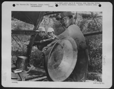 Thumbnail for General > Once Part Of An Aircraft -- Now A Huge Pan - The Large Aluminum Pan Once Was Part Of An Aircraft, Either American Or Japanese, Which Flew In The Battle Of Okinawa In 1945.  The Workman Is Putting The Finishing Touches To The Pan, Which Was Fasioned In Thi