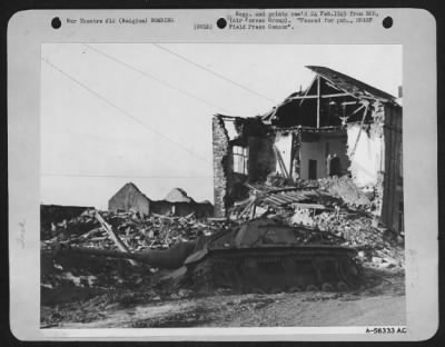 Thumbnail for General > The intensity of a recent 9th AF fighter-bomber attack which knocked out this German Tiger tank east of Luxembourg, Belgium is indicated by the demolished wall of the building in the background and the surrounding rubble. Pilots of the three TAC