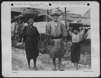 Thumbnail for General > Natives Pose Willingly For Photographer - In The Village Of Koza Near Kadena These Three Natives Posed For The Air Force Photographer.  The Old Gentleman In The Center Proved To Be One Of The More Substantial Citizens Of The Village, What With His Straw H