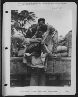 Thumbnail for General > Okinawans Get Surplus Unusable Military Food Supplies - A Proportion Of Okinawan'S Daily Diet Is Provided By Unusable Military Surplus Food Which Is Doled Out When Availabel To The Natives Through Rationing Boards.  This Scene Shows An Okinawan Girl Takin