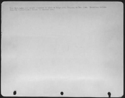 Thumbnail for General > four Nazi tanks were caught dispersed in Field in Bulge area, Belgium, 24 Dec. 1944. Incendiary bullets from 9th fighter-bomber strike the nearest tank.