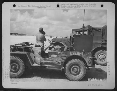 General > Traffic Control Gun Being Operated From The Edge Of The Airstrip By A Member Of The 149Th Army Airways Communications System, Giving Landing Instructions To A North American P-51 "Mustang" Of The 35Th Fighter Group.  The Strip Was Not Officially Opened, B