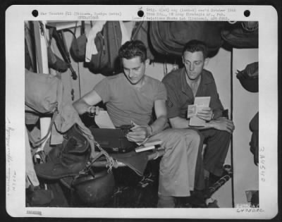 General > Two Men Of The Orderly Section, 163Rd Liaison Squadron, Cramped For Space Aboard The Uss Shelby, Use Bunk To Make Up Their Morning Report.  The Squadron Is Transferring From Schofield Barracks, Oahu, Hawaiian Islands To Okinawa, Ryukyu Retto.