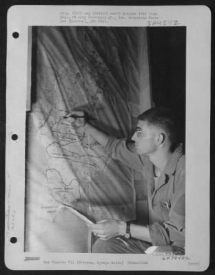 Thumbnail for General > A Member Of The 163Rd Liaison Squadron, 10Th Army, Looking Over Situation Map Which Shows The Daily Course Of Battle On Okinawa, Ryukyu Retto.