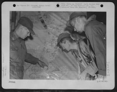 General > Members Of The 163Rd Liaison Squadron, 10Th Army, Checking Over Situation Map Which Shows The Daily Course Of Battle On Okinawa, Ryukyu Retto.