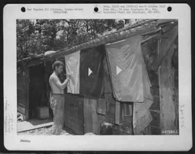 Thumbnail for General > Gi Of The 163Rd Liaison Squadron, 10Th Army Painting Alert Warning Flags To Be Used On Airstrips.  In This Manner Planes Returning From Missions Are Warned Of The Impending Danger Of Japanese Air Attacks.  Okinawa, Ryukyu Retto.