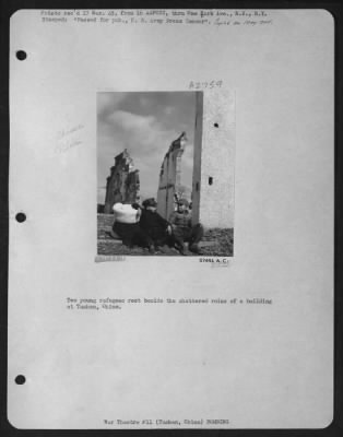 Thumbnail for Tuhshan > Two Young Refugees Rest Beside The Shattered Ruins Of A Building At Tushan, China.