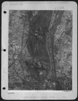 Brussels > USAAF HITS BRUSSELS MARSHALLING YARDS. Twin concentrations of bombs, unleashed by Liberators of the U.S. Army 8th Air force envelope a section of the railway marshalling yards at Brussels, known to be the largest of its kind in Belgium.