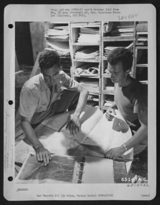 General > Intelligence Clerks Must Work Hours Before A Mission Digging Out And Preparing Target, Course And Other Information That Will Be Passed On To The Pilots.  Enlisted Men Of The 318Th Fighter Group Compiling Data Area, Left To Right: T/Sgt. Charles L. Waters