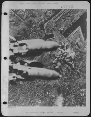 Thumbnail for Ghent > Almost hiding the target from view, bombs from attacking U.S. 8th AAF heavy bombers plunge toward the rail marshalling yards at Ghent, Belgium, during the 22 June 44 attack.