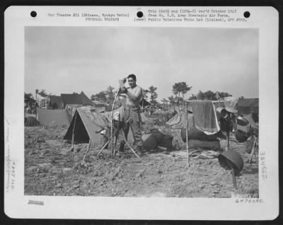 General > A Member Of The 1878Th Engineer Aviation Battalion Takes Time Out For Personal Grooming.  Okinawa, Ryukyu Retto, May 1945.