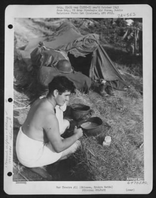 Thumbnail for General > A Member Of The 1878Th Engineer Aviation Battalion Finds That A Helmet Serves A Double Purpose - As A Head Protector And As A Wash Basin.  Okinawa, Ryukyu Retto, May 1945.