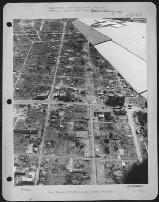 Thumbnail for Hiroshima > Pacific Air Command, U.S. Army - 3 August 1946 - An Aerial View Of Hiroshima, Japan On Year After It Was Hit By The First Atomic Bomb To Be Dropped By The Army Air Forces Shows Only A Few New Houses Being Erected On The Scorched Earth In The Center Of The