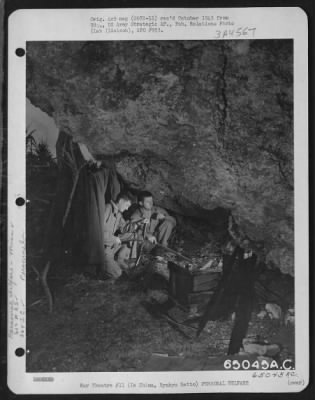 General > A Fire Under An Overhanging Rock Dries Sodden 'Gi' Blankets The Morning After A Drenching Rain On Pup-Tent Dwellers Of The 612Th Air Engineer Squadron 364Th Service Group.  The Men Are, Left To Right: Sgt. Gordon J. Essler Of 18 Railroad Ave., Beverly Mas