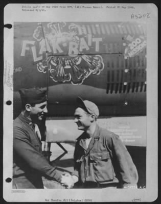 Thumbnail for General > S/Sgt. Clair G. Goodrich, 20 Charles St., Coldwater Michigan, Receives Congratulations From His Squadron Commanding Officer, Maj. John C. Ruse, 27 S. Stone Ave., La Grange, Ill., For His Excellent Work As Crew Chief Of The 9Th A.F.  B-26 Marauder 'Flak Ba