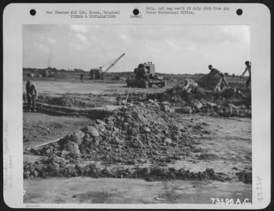 Thumbnail for General > Soldiers Of The 834Th Engineer Aviation Battalion And Civilians Fill In Bomb Craters At An Airfield In St. Trond, Belgium.  22 Sept. 1944 834Th Engineer Aviation Battalion.