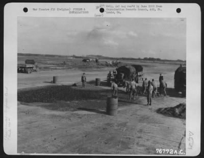 Thumbnail for General > Men Of The 834Th Engineer Aviation Battalion Fill Up Bomb Crater During The Repair Of An Airfield At St. Trond, Belgium, 27 September 1944.