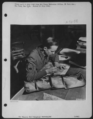 Thumbnail for General > T/Sgt. John Mcnicol, Photo Plotter, Checks Photographs To Determine If Reconnaissance Crews Covered Areas Indicated In Field Orders.