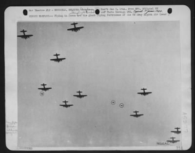 General > Winged Warfare -- Flying In Force Are The Giant Flying Fortresses Of The Us Army Eighth Air Force Brussell-Bound For Vital Factory Targets.  The Bombers Were Engaged By Enemy Fighter Opposition (Shown Encircled).  This Unusual Action Photo Was Recorded Be