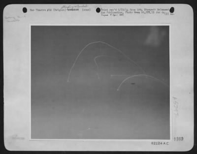 Thumbnail for General > Four Ground-Fired Rockets Criss-Cross Near A B-17 "Flying Fortress" Of The U.S. Eighth Aaf As It Attacked Targets In Belgium.