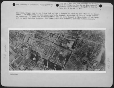 Thumbnail for Debreczen > Debreczen, Hungary was hit on 2 June 1944 by 15th AF bobmers on their way from Italy to the Soviet bases. The rail yards and shop areas were badly damaged. Annotated are (6) all tracks severed or obstructed, (7) many hits on rolling stock, (8) car