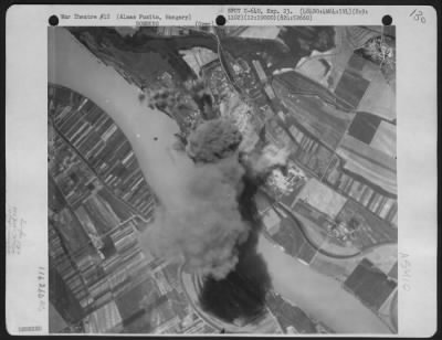 Thumbnail for Almasfuzito > A Towering Column Of Smoke Rises Over The Almas Fuzito Oil Refinery, Hungary After Planes Of The 484Th Bomb Group, 824Th Bomb Squadron Dropped Their Bombs On 9 August 1944.