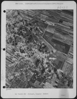 Thumbnail for Budapest > Bombs Bursts Cover Installations At Budapest Tokol Airdrome, Hungary, On August 9, 1944, After Planes Of The 464Th Bombardment Group, 776Th Bombardment Squadron, 15Th Air Force, Dropped Their Lethal Loads Of Bombs.