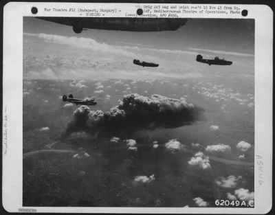 Thumbnail for Budapest > Bombing Of Oil Refinery At Budapest, Hungary, By Consoldiated B-24 "Liberators" Of The 15Th Air Force On 2 July 1944.  Three Of The "Liberators" Shown Leaving The Smoking Target.