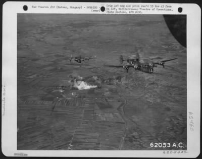 Thumbnail for Hatvan > Bombing Of Hatvan, Hungary, By Consolidated B-24 "Liberators" Of The 15Th Air Force, On 20 September 1944.  Two Of The "Liberators" Shown Leaving The Smoking Target.