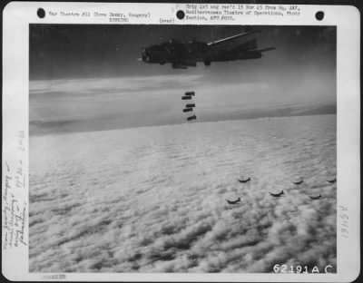 Thumbnail for Novezamky > Bombs Away!  A String Of Bombs Is Released By A Boeing B-17 "Flying Fortress", Part Of A Formation Attacking Enemy Installations At Nove Zamky, Hungary On 7 October 1944.