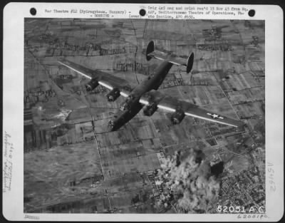 Nyiregyhaza > Bombing Of Nyiregyhaza, Hungary, By Consolidated B-24 "Liberators" Of The 15Th Air Force, On 6 September 1944.  One Of The "Liberators" Shown Over The Smoking Target.