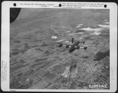 Thumbnail for Nyiregyhaza > Bombing Of Marshalling Yards At Nyiregyhaza, Hungary, By Consolidated B-24 "Liberators" Of The 15Th Air Force, On 6 September 1944.  Formation Of "Liberators" Shown Over The Smoking Target.