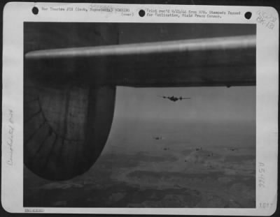 Thumbnail for Szob > This Formation Of Consolidated B-24 Liberators Of The 15Th Air Force Are Shwon Flying Over The Szob Railroad Bridge In Yugoslavia On Sept. 5, 1944.  Hits Were Seen On Both Approaches, But The Bridge Itself Was Believed Not Hit.