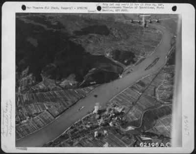 Szob > Homeward Bound This Consolidated B-24 'Liberator' Of The 15Th Air Force Leaves Behind A Smashed Railroad Bridge Near Szob, Hungary.  5 September 1944.